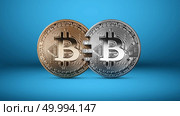 Silver and gold bitcoin coins on a blue background.The concept of blockchain technology and money transfers. Mastercard analog concept. Conceptual image for crypto currency market. Can be used for video or site cove. Silver and gold bitcoin coins on a blue background money transfer concept. Стоковое фото, агентство Ingram Publishing / Фотобанк Лори