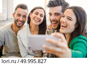 Friends faving fun and making a selfie. Стоковое фото, агентство Ingram Publishing / Фотобанк Лори