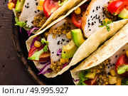 Mexican tacos with chicken meat, vegetables and fresh greens. Стоковое фото, агентство Ingram Publishing / Фотобанк Лори