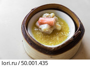Chinese dim sum in wooden basket. Стоковое фото, агентство Ingram Publishing / Фотобанк Лори