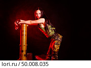 Portrait of attractive woman in military style. Стоковое фото, агентство Ingram Publishing / Фотобанк Лори