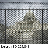 USA shutdown crisis and United States government closed and american federal shut down due to spending bill disagreement between the left and the right with a border fence with 3D illustration elements. Стоковое фото, агентство Ingram Publishing / Фотобанк Лори