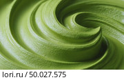 Matcha cream rotating slowly in minimalist style. Стоковое AI-видео, аниматор Юрий Поздников / Фотобанк Лори
