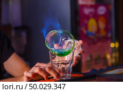 cocktail preparation with absinthe on the bar. close-up. Стоковое фото, агентство Ingram Publishing / Фотобанк Лори