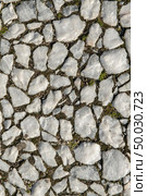 Typical portuguese cobblestone handmade pavement of white square fragments. Стоковое фото, агентство Ingram Publishing / Фотобанк Лори