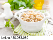 Barley porridge on white background. Стоковое фото, агентство Ingram Publishing / Фотобанк Лори