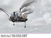 Pollution in food and toxic chemical eat,surreal,surrealistic,idea,contaminants that people ingest as a health and safety concept as a spoon  with polluting industry dripping with petroleum as a 3D illustration. Стоковое фото, агентство Ingram Publishing / Фотобанк Лори