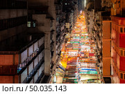 Aerial View of Temple street night flea market illumination in Kowloon Hong Kong. Стоковое фото, агентство Ingram Publishing / Фотобанк Лори