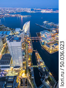 Aerial view of panoramic modern city in Yokohama City Japan with blue hour after sunset in th evening. Yokohama is the second largest city in Japan by population. Стоковое фото, агентство Ingram Publishing / Фотобанк Лори
