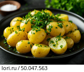 Potatoes are disgusting on a dark table. AI generated. Стоковое AI-изображение, AI-художник Анна Никонорова / Фотобанк Лори