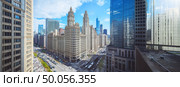 A cityscape with tall buildings and a busy street. Стоковое AI-изображение, AI-художник Ярославский Максим / Фотобанк Лори