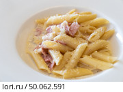 Carbonara pasta, spaghetti with pancetta, egg, hard parmesan cheese cream sauce  ham and bacon.  Pasta alla carbonara is traditional italian cuisine. . Стоковое фото, агентство Ingram Publishing / Фотобанк Лори