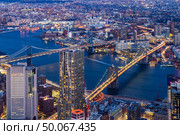 Aerial view of Brooklyn bridge and Manhattan bridge with Brooklyn cityscape skyscrapers bulding from Lower Manhattan in  New York City  New York State NY , USA. Стоковое фото, агентство Ingram Publishing / Фотобанк Лори