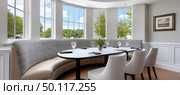 Elegant dining area with panoramic windows and cozy seating. Стоковое AI-изображение, AI-художник Юрий Поздников / Фотобанк Лори