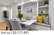 Cozy dining nook with elegant decor and cushions. Стоковое AI-изображение, AI-художник Юрий Поздников / Фотобанк Лори