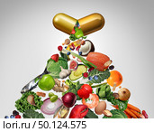 Food supplement vitamin dietary pill as a nutrient capsule with fruit vegetables nuts and beans inside as a natural medicine health treatment with 3D illustration elements. Стоковое фото, агентство Ingram Publishing / Фотобанк Лори