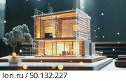 Modern, multi-story house with glass walls is overlaid with a digital network of glowing lines and dots, suggesting smart home integration and connectivity. Стоковое AI-видео, аниматор Елена Никишина / Фотобанк Лори