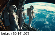 Astronauts looking at Earth planet from a space station during a mission in low Earth orbit. Стоковое AI-изображение, AI-художник Михаил Коханчиков / Фотобанк Лори