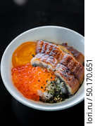 Unagi don Donburi with salmon roe and egg. Стоковое фото, агентство Ingram Publishing / Фотобанк Лори