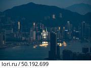 Sunset over Victoria Harbor as viewed atop Victoria Peak. Стоковое фото, агентство Ingram Publishing / Фотобанк Лори