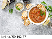 Eggplant hummus with ingredients for cooking. Traditional vegan arabic aubergine appetizer. Baba Ghanoush. Стоковое фото, агентство Ingram Publishing / Фотобанк Лори