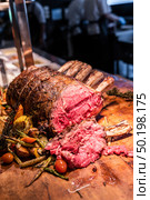 Wagyu beef roast prime rib, Carving food. Стоковое фото, агентство Ingram Publishing / Фотобанк Лори