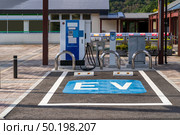 EV Station Charger for electrical vehicle car using as green environmental concept. Стоковое фото, агентство Ingram Publishing / Фотобанк Лори