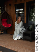 Cozy Retreat Woman Enjoying Quiet Morning at a Country House. Стоковое фото, фотограф Aleksandr Golubev / Фотобанк Лори