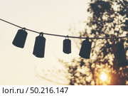 Bells arranged together during the sunset. Стоковое фото, агентство Ingram Publishing / Фотобанк Лори