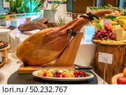 Parma Ham leg cold cut with variety of fruit. Стоковое фото, агентство Ingram Publishing / Фотобанк Лори