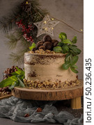 Delicious naked coffee and hazelnuts cake on table rustic wood kitchen countertop. Стоковое фото, агентство Ingram Publishing / Фотобанк Лори