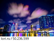 Macau cityscape at night, all hotel and tower are colorful lighten up with blue sky, Macau, China. Стоковое фото, агентство Ingram Publishing / Фотобанк Лори
