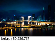 Macau cityscape at night, all hotel and tower are colorful lighten up with blue sky, Macau, China. Стоковое фото, агентство Ingram Publishing / Фотобанк Лори