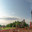 Drilling a well in an oil field. In the foreground is a mobile drilling rig. In the background, oil production at the field using a rocking machine. Summer. Beautiful sky and nature. Стоковое фото, фотограф Владимир Ендовицкий / Фотобанк Лори