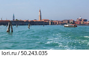 View of Basilica Di San Giogio Maggiore in Venice at day. Long exposure photo. Venice, Italy. Beautiful blue water.. Venice canal scene in Italy. Стоковое фото, агентство Ingram Publishing / Фотобанк Лори