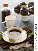 Chocolate muffins with fresh blueberry and cofee cup for breakfast. Стоковое фото, агентство Ingram Publishing / Фотобанк Лори