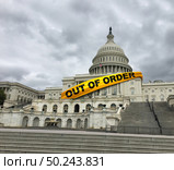 Out of order US congress and inept United States politics or American political house majority incompetent government between republicans and democrats in Washington DC capital legislature in a 3D illustration style. Стоковое фото, агентство Ingram Publishing / Фотобанк Лори