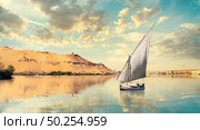 Clouds over river Nile and sailboat in Aswan at sunset. Стоковое фото, агентство Ingram Publishing / Фотобанк Лори
