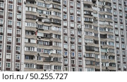 Facade of residential building showing balconies and air conditioners. Стоковое видео, видеограф Mikhail Davidovich / Фотобанк Лори