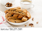 Biscotti cookies with dried cranberry, walnuts and with a cup of coffee . Стоковое фото, агентство Ingram Publishing / Фотобанк Лори