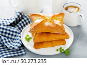 Savory salted pies with pumpkin and onion. Стоковое фото, агентство Ingram Publishing / Фотобанк Лори