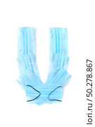 Capital letter U handmade from medical antibacterial protective blue face masks on a white background, copy space. Creative alphabet for making up new words.. Letter U made from protective medical masks on a white background. Стоковое фото, агентство Ingram Publishing / Фотобанк Лори