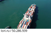 Cargo ship filled with containers in port area. Стоковое фото, фотограф Михаил Коханчиков / Фотобанк Лори