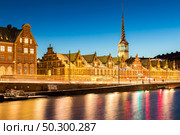Copenhagen Cityscape with skyline skyscraper building downtown city at sunset twilight night Denmark Scandinavia in Europe. Landmark city life and nightlife concept. Стоковое фото, агентство Ingram Publishing / Фотобанк Лори
