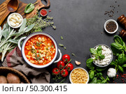 Cooking pasta e fagioli soup with chicken meat and vegetables, italian cuisine. Стоковое фото, агентство Ingram Publishing / Фотобанк Лори