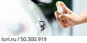 panoramic of car vehicle sterilization cleaning using hand spraying alcohol, disinfectant spray on cdoor handle for safety prevent protect from virus and germ infection Covid-19 coronavirus pandemic. Стоковое фото, агентство Ingram Publishing / Фотобанк Лори