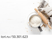 Flour on white kitchen worktop, baking culinary background, copy space, overhead view. Стоковое фото, агентство Ingram Publishing / Фотобанк Лори