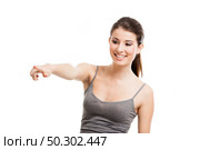 Portrait of a beautiful young woman pointing to somewhere, isolated on white. Стоковое фото, агентство Ingram Publishing / Фотобанк Лори