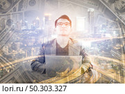 Double exposure of business working with money and cityscape at night background. Стоковое фото, агентство Ingram Publishing / Фотобанк Лори