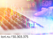 Double exposure of Businessman calculating the information with laptop. Стоковое фото, агентство Ingram Publishing / Фотобанк Лори